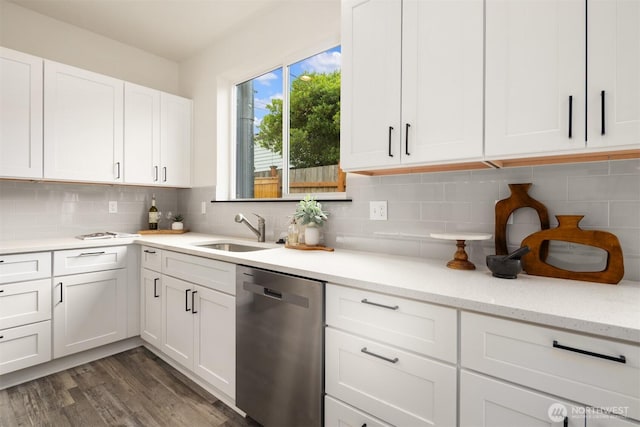 9245 Kelsey Ln SW, Seattle, WA 98106 - kitchen featuring stainless steel dishwasher, white cabinetry, tasteful backsplash, and dark wood finished floors