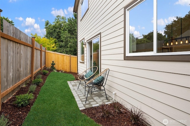 9245 Kelsey Ln SW, Seattle, WA 98106 - fenced backyard featuring a patio