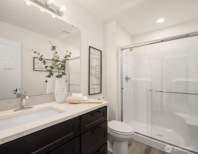 9245 Kelsey Ln SW, Seattle, WA 98106 - full bathroom featuring a stall shower, vanity, and wood finished floors