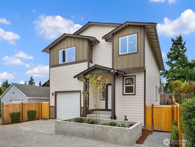 9245 Kelsey Ln SW, Seattle, WA 98106 - view of front of house featuring board and batten siding, an attached garage, and driveway