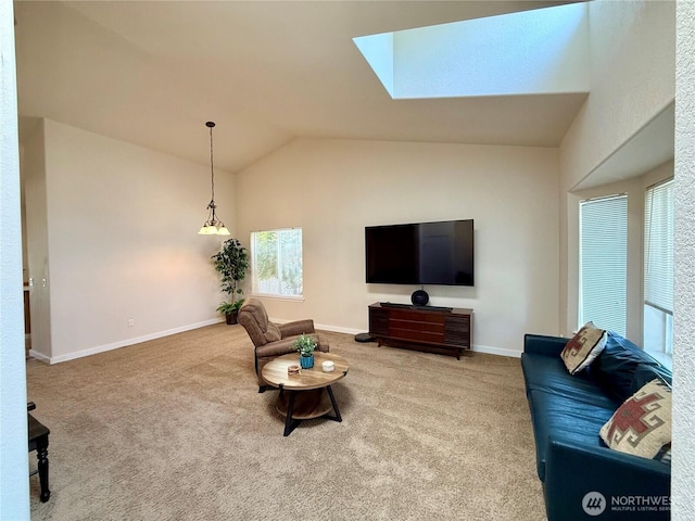 4304 Seville Dr SE, Lacey, WA 98503 - carpeted living room with vaulted ceiling, a skylight, and baseboards