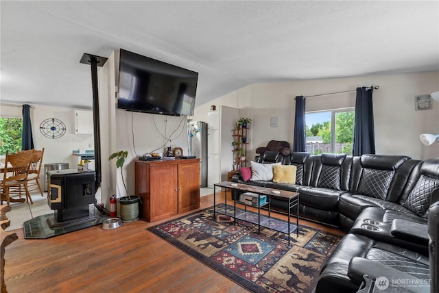 2614 48th Ave, Longview, WA 98632 - living room with plenty of natural light, a wood stove, light wood-style floors, and vaulted ceiling