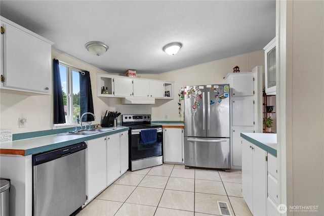 2614 48th Ave, Longview, WA 98632 - kitchen featuring stainless steel appliances, a sink, under cabinet range hood, and white cabinetry