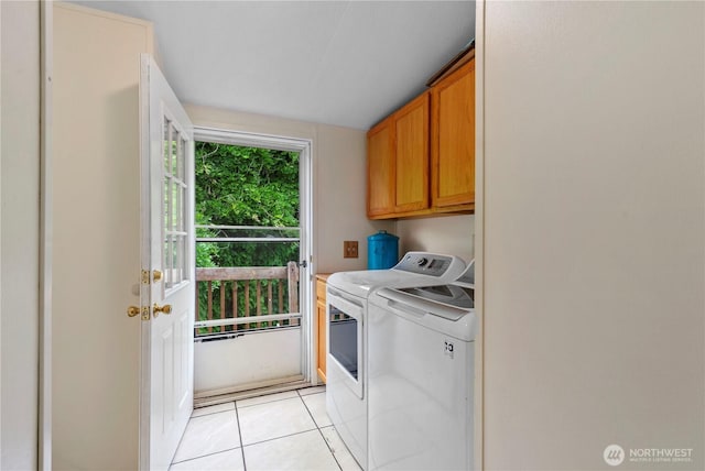 2614 48th Ave, Longview, WA 98632 - washroom featuring cabinet space, washing machine and clothes dryer, and light tile patterned floors