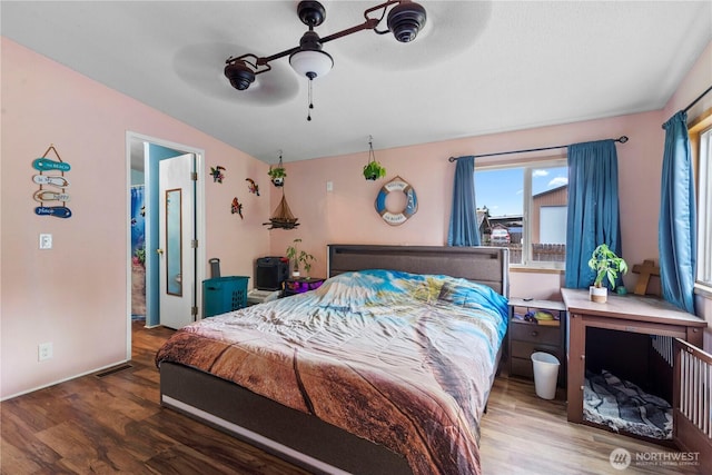 2614 48th Ave, Longview, WA 98632 - bedroom with wood finished floors, vaulted ceiling, a ceiling fan, and baseboards