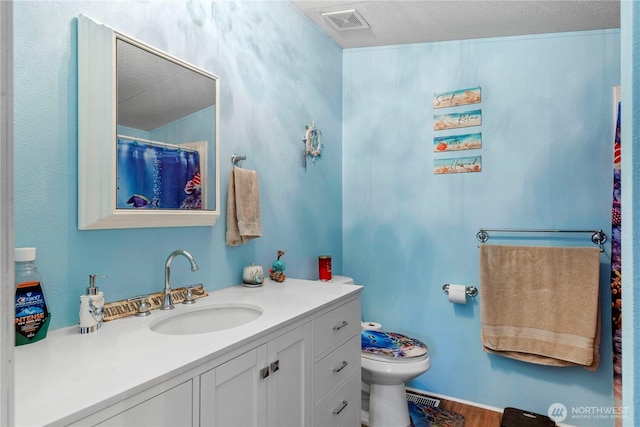 2614 48th Ave, Longview, WA 98632 - full bathroom with toilet, vanity, and wood finished floors