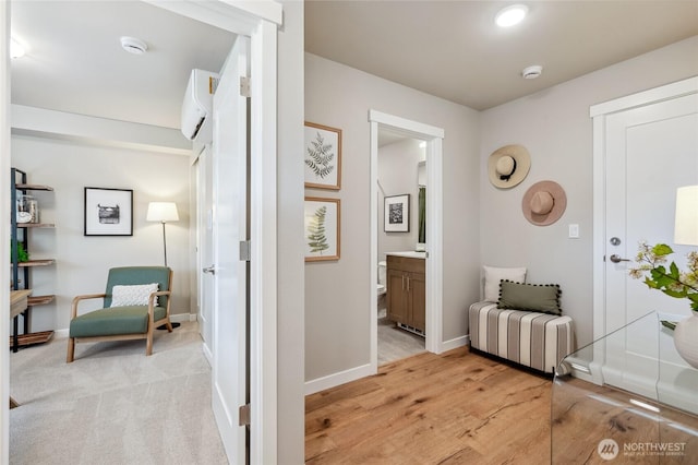 1322 194th St SE Unit H6, Bothell, WA 98012 - hallway with baseboards, light wood-style flooring, and an AC wall unit