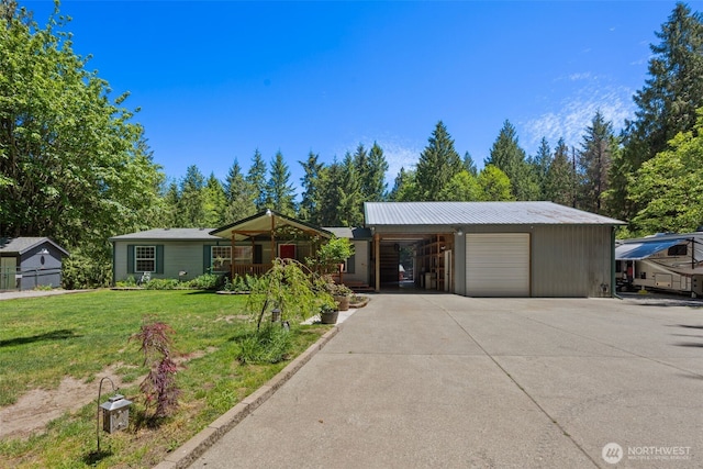16605 259th Avenue Ct E, Buckley, WA 98321 - ranch-style home with a front lawn, driveway, metal roof, a garage, and a carport