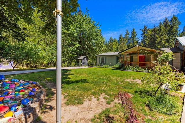 16605 259th Avenue Ct E, Buckley, WA 98321 - view of green lawn with covered porch