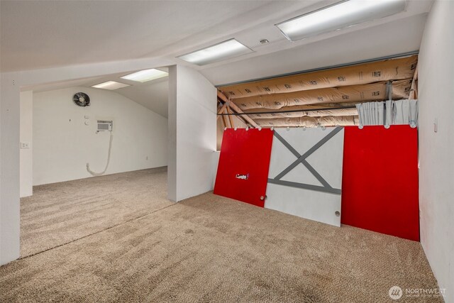 16605 259th Avenue Ct E, Buckley, WA 98321 - carpeted empty room featuring a wall mounted AC and vaulted ceiling