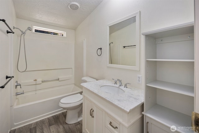 16605 259th Avenue Ct E, Buckley, WA 98321 - bathroom featuring wood finished floors, vanity, shower / bathtub combination, and toilet