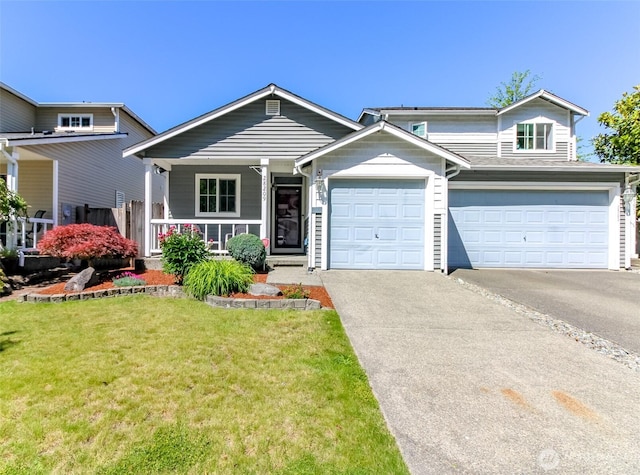 28209 241st Ave SE, Maple Valley, WA 98038 - view of front of home with driveway, a front yard, covered porch, and a garage