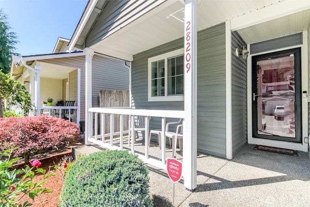28209 241st Ave SE, Maple Valley, WA 98038 - doorway to property featuring a porch