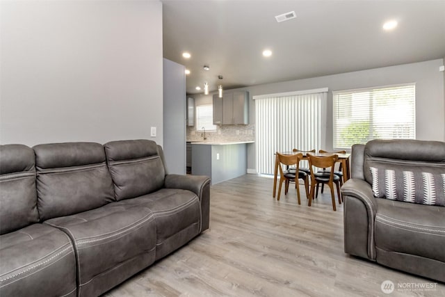 28209 241st Ave SE, Maple Valley, WA 98038 - living room featuring light wood-type flooring and recessed lighting