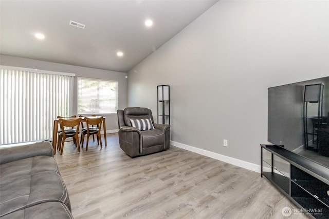 28209 241st Ave SE, Maple Valley, WA 98038 - living room featuring baseboards, high vaulted ceiling, light wood-type flooring, and recessed lighting