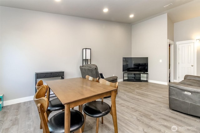 28209 241st Ave SE, Maple Valley, WA 98038 - dining room with light wood-style flooring, baseboards, recessed lighting, and vaulted ceiling