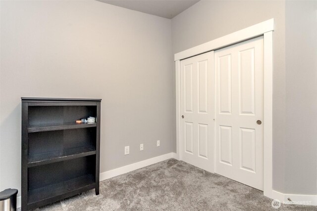 28209 241st Ave SE, Maple Valley, WA 98038 - unfurnished bedroom with carpet floors, a closet, and baseboards