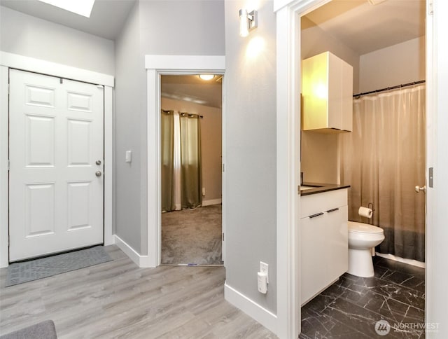 28209 241st Ave SE, Maple Valley, WA 98038 - foyer entrance with baseboards and wood finished floors