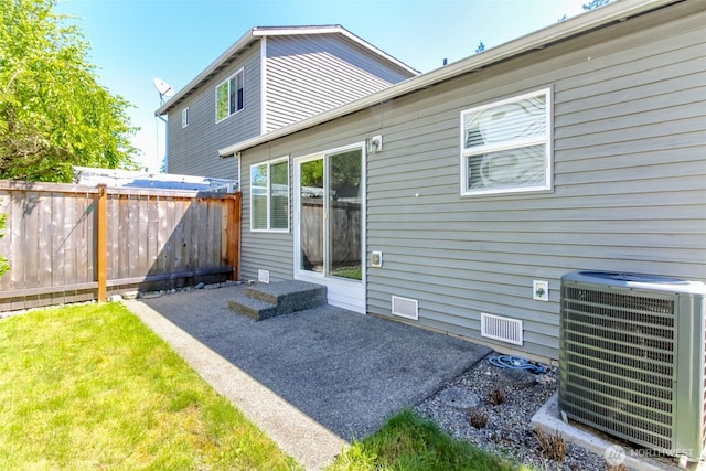 28209 241st Ave SE, Maple Valley, WA 98038 - back of house with central air condition unit and a patio