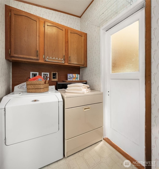7459 SW 255th St, Vashon, WA 98070 - laundry room featuring wallpapered walls, washer and dryer, cabinet space, light flooring, and ornamental molding