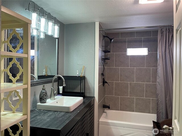 22000 29th Ct S Unit 16, Des Moines, WA 98198 - full bath with shower / tub combo with curtain, vanity, a textured wall, and a textured ceiling