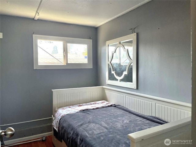 22000 29th Ct S Unit 16, Des Moines, WA 98198 - bedroom with multiple windows, wood finished floors, and a wainscoted wall