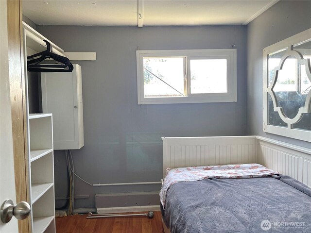 22000 29th Ct S Unit 16, Des Moines, WA 98198 - bedroom featuring multiple windows and wood finished floors