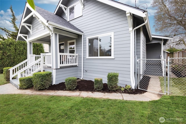 2333 31st Ave S, Seattle, WA 98144 - view of home's exterior featuring a porch and a gate