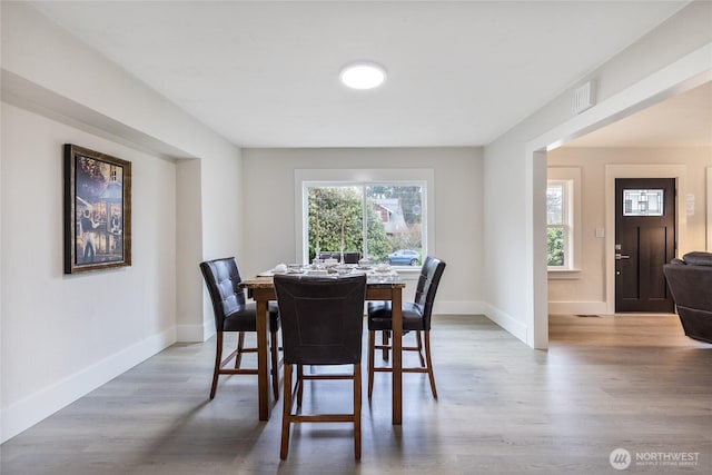 2333 31st Ave S, Seattle, WA 98144 - dining room featuring baseboards and wood finished floors