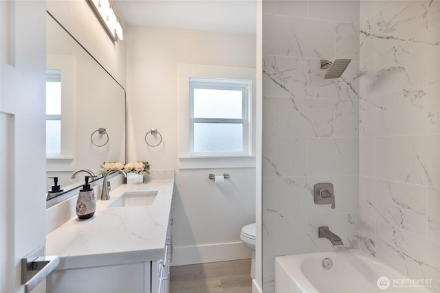 2333 31st Ave S, Seattle, WA 98144 - full bathroom featuring vanity, toilet, bathtub / shower combination, wood finished floors, and baseboards