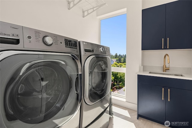 10227 26th Ave SW, Seattle, WA 98146 - laundry area featuring washer and clothes dryer and cabinet space