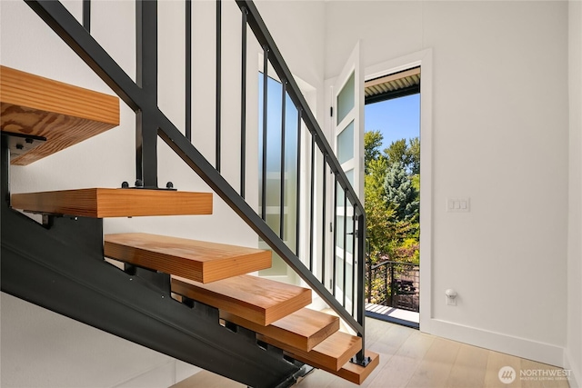 10227 26th Ave SW, Seattle, WA 98146 - stairway with baseboards and wood finished floors