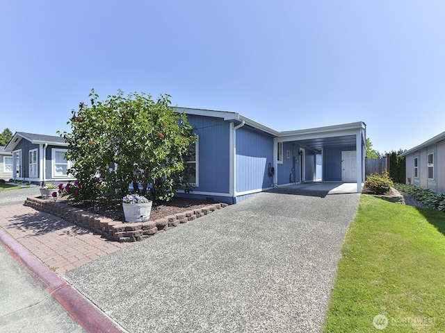 27460 149th Pl SE Unit 85, Kent, WA 98042 - view of front facade featuring asphalt driveway and a carport