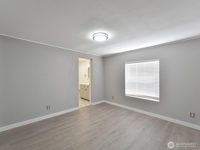27460 149th Pl SE Unit 85, Kent, WA 98042 - spare room featuring light wood-style flooring and baseboards