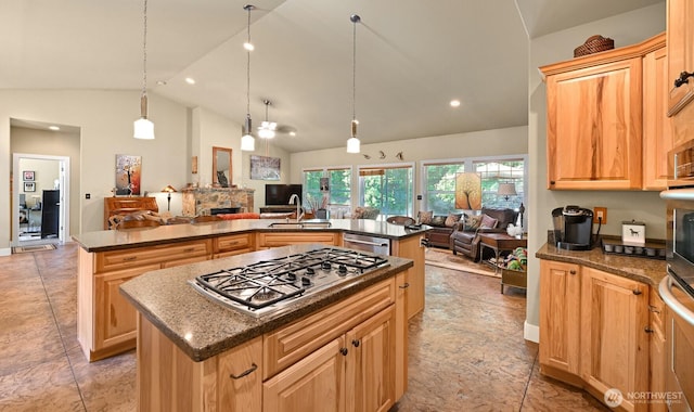 9135 Custer School Rd, Custer, WA 98240 - kitchen featuring an island with sink, open floor plan, a sink, stainless steel appliances, and a fireplace