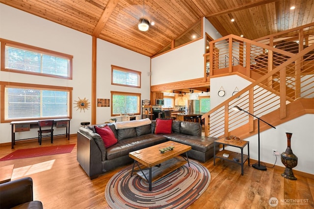 9135 Custer School Rd, Custer, WA 98240 - living room with high vaulted ceiling, wooden ceiling, stairway, wood finished floors, and baseboards