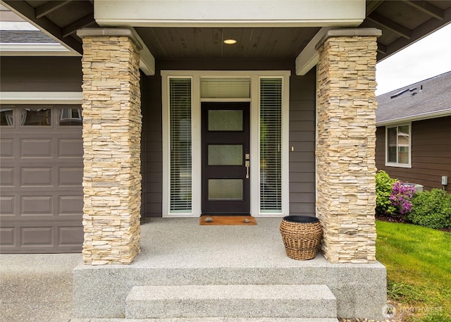 421 Lofgrin Rd, Sequim, WA 98382 - view of exterior entry featuring covered porch and a garage