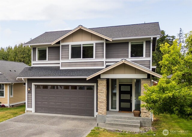 421 Lofgrin Rd, Sequim, WA 98382 - view of front of home with driveway, board and batten siding, a garage, roof with shingles, and stone siding