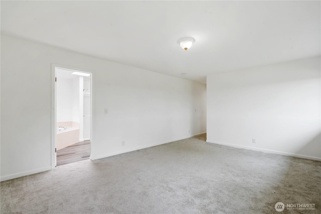 1258 NW Timber Shadow Ct, Silverdale, WA 98380 - carpeted spare room featuring baseboards