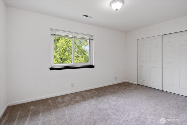 1258 NW Timber Shadow Ct, Silverdale, WA 98380 - unfurnished bedroom with carpet floors, baseboards, and a closet