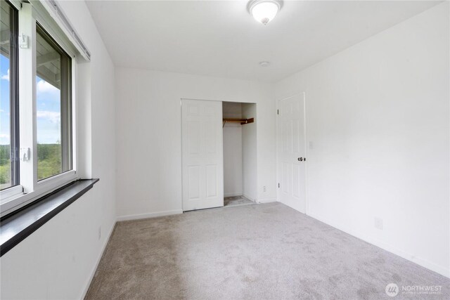 1258 NW Timber Shadow Ct, Silverdale, WA 98380 - unfurnished bedroom featuring carpet flooring, baseboards, and a closet