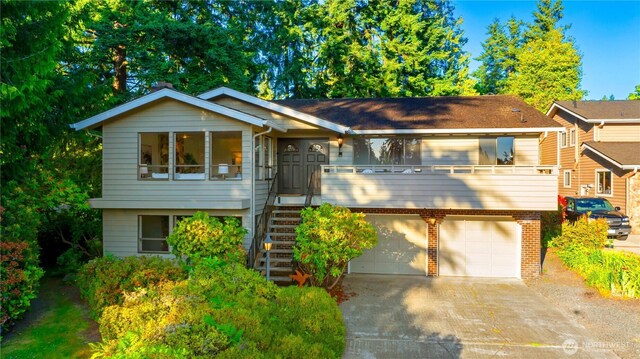 18801 86th Pl W, Edmonds, WA 98026 - view of front facade featuring driveway, a garage, and stairway