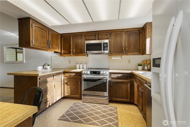 18801 86th Pl W, Edmonds, WA 98026 - kitchen with stainless steel appliances and light countertops