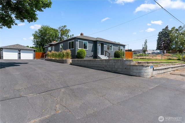 367 1st St SE, East Wenatchee, WA 98802 - view of front of home with a garage and an outdoor structure