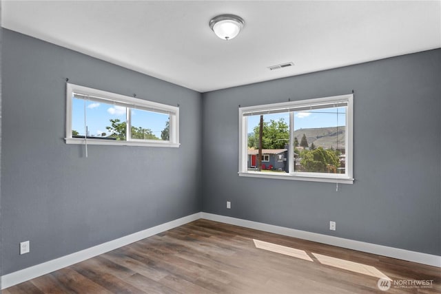 367 1st St SE, East Wenatchee, WA 98802 - unfurnished room featuring wood finished floors and baseboards
