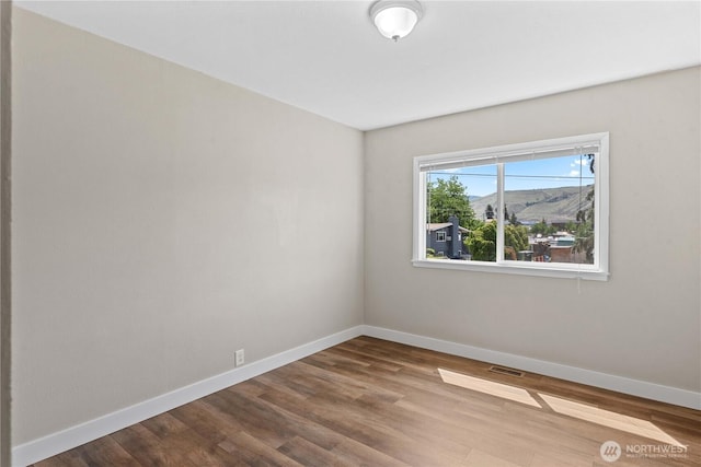 367 1st St SE, East Wenatchee, WA 98802 - empty room featuring baseboards and wood finished floors