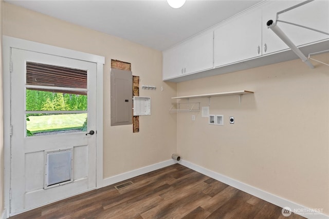 367 1st St SE, East Wenatchee, WA 98802 - washroom featuring cabinet space, baseboards, dark wood finished floors, electric panel, and washer hookup