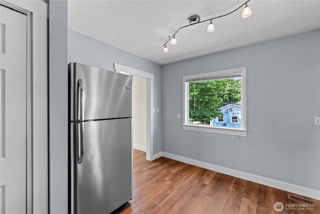 367 1st St SE, East Wenatchee, WA 98802 - kitchen with freestanding refrigerator, wood finished floors, and baseboards