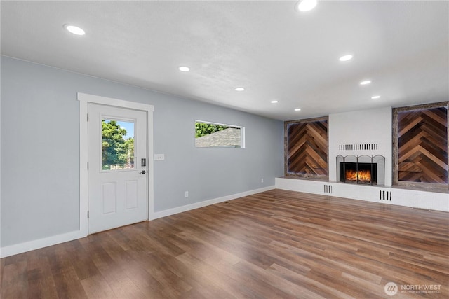 367 1st St SE, East Wenatchee, WA 98802 - unfurnished living room with recessed lighting, a large fireplace, wood finished floors, and baseboards