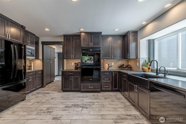 628 Meadows Dr, Wenatchee, WA 98801 - kitchen featuring black appliances, a sink, light wood-style floors, dark brown cabinetry, and backsplash